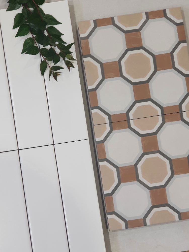Porcelain pattern floor tiles with warm neutral tones flat lay