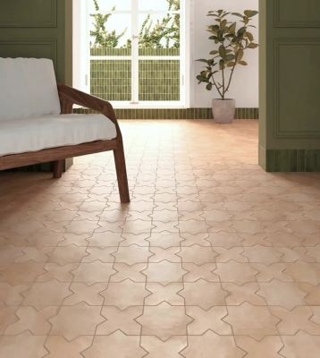 Terracotta look interlocking shaped floor tiles in a sunny living room