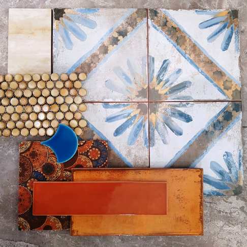 Blue Moroccan pattern tile with copper and orange accent tiles