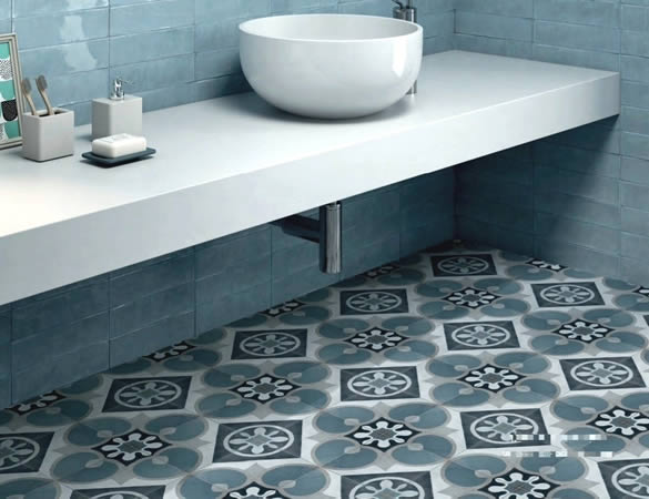 Bathroom with white vessel basin, blue wall tiles and blue vintage pattern floor tiles in Sydney