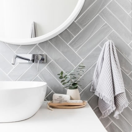 Herringbone pattern subway tiles in a bathroom