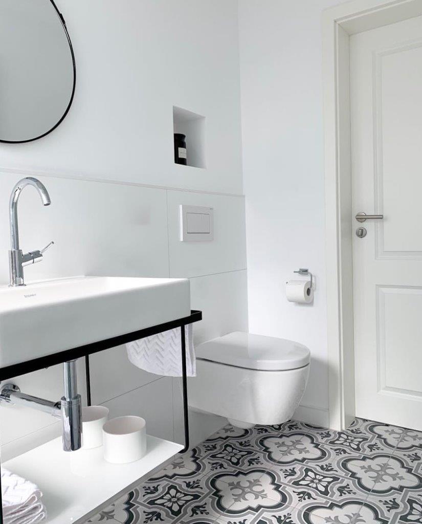 Black and white bathroom tiles laid