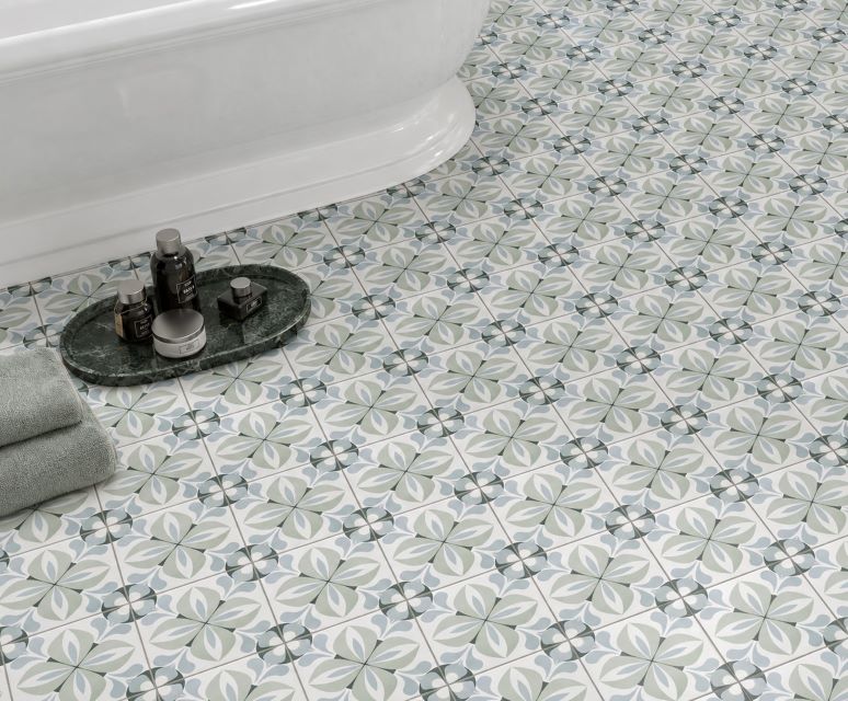 Close up of Moss Green and Light Blue encaustic look bathroom tile pattern