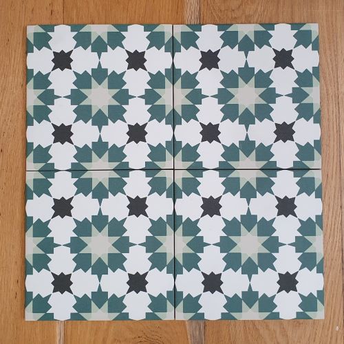 KC956 deep green, sage and charcoal star pattern tile on white, four tiles laid together on timber