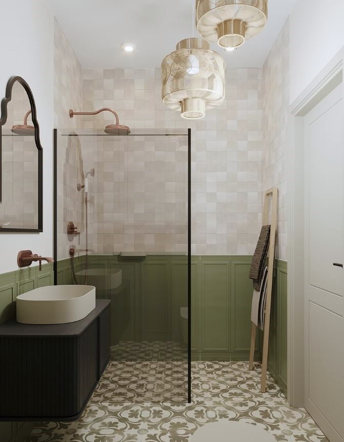 Bathroom with green half-tiled walls and sage green pattern floor tiles