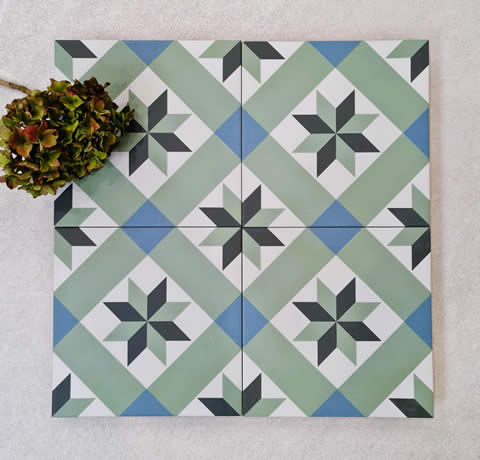 Green, blue and charcoal heritage star pattern tile on timber