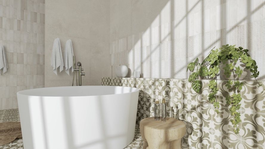 Freestanding bath with sage green pattern tiles on the wall, Australia