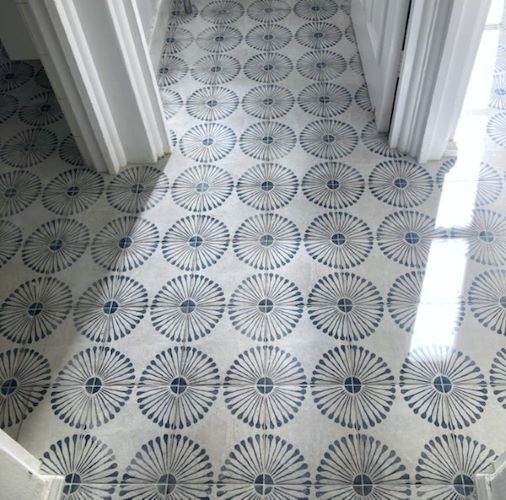 Blue pattern vintage tiles laid in a hallway