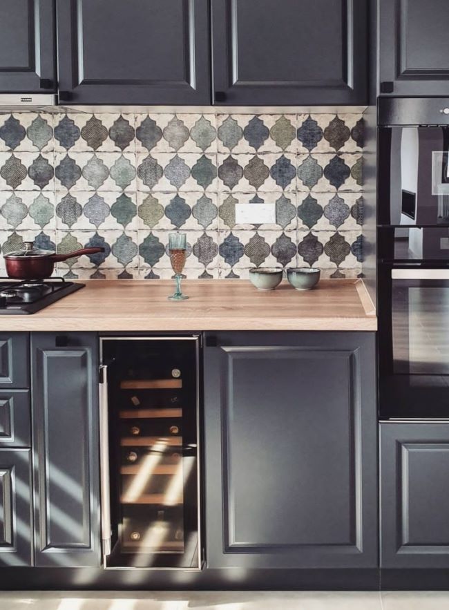 Moroccan tiles laid as a kitchen splashback