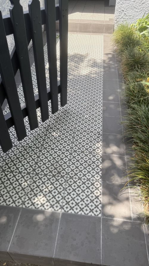 monochrome black and white pattern tiles laid outdoors