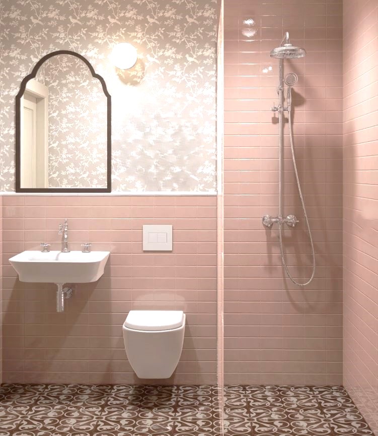 Pink bathroom with arched mirror and terracotta pattern floor tiles, Australia