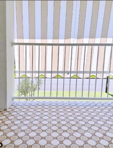 Retro geometric pattern floor tiles in an outdoor area