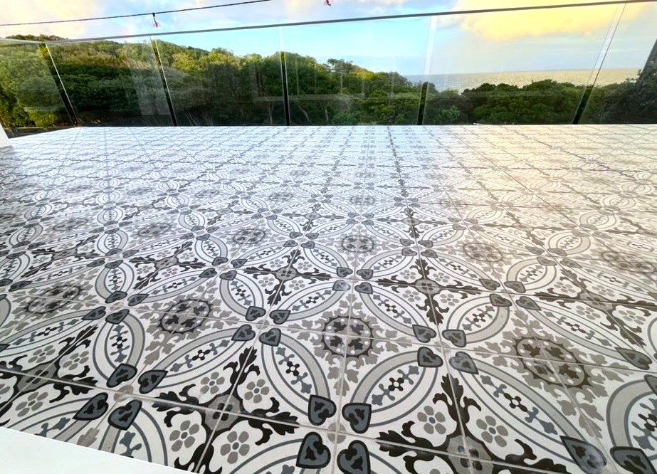 Encaustic look pattern tiles on a verandah, Australia